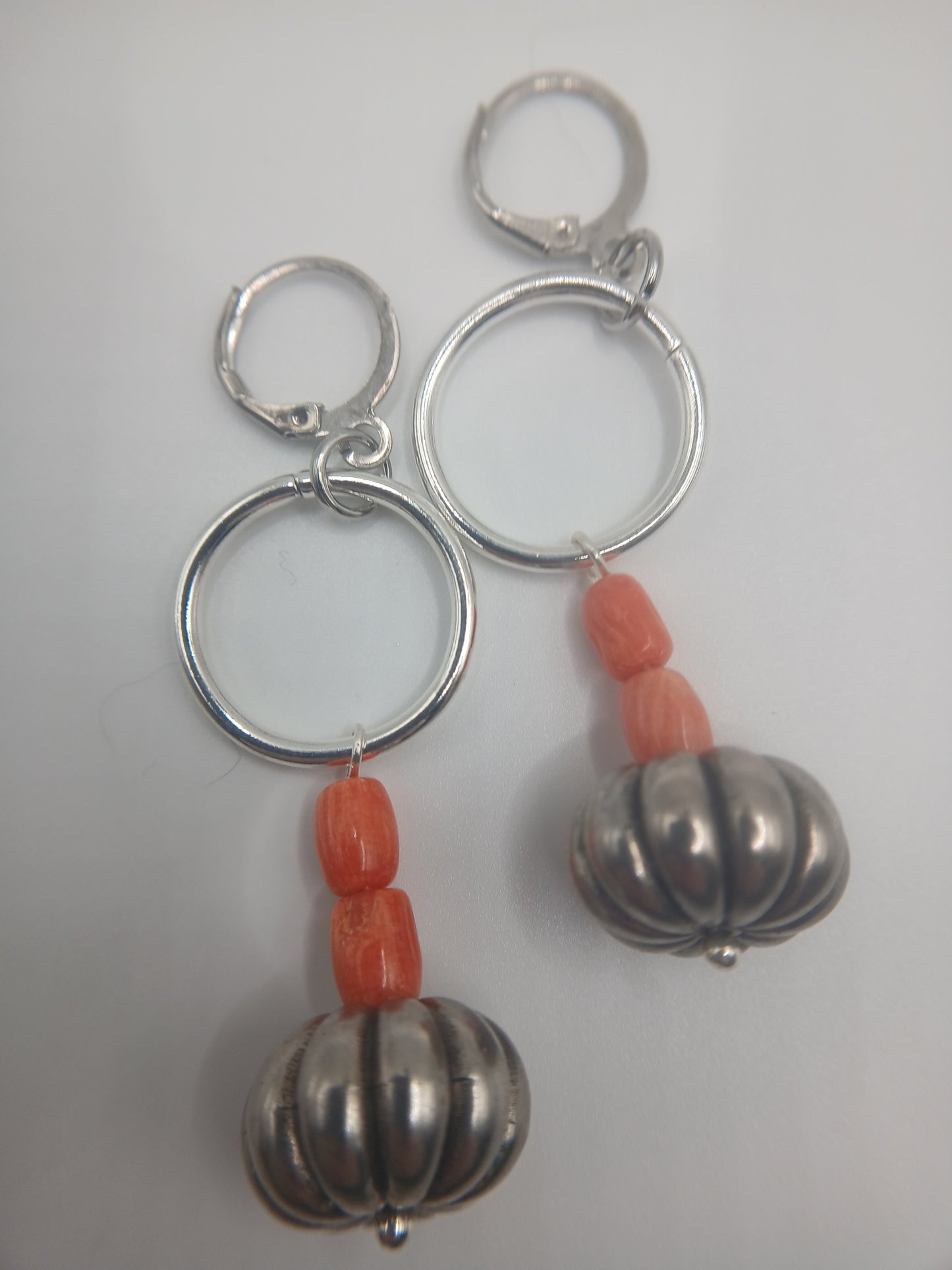 Silver circles and natural coral beads earrings