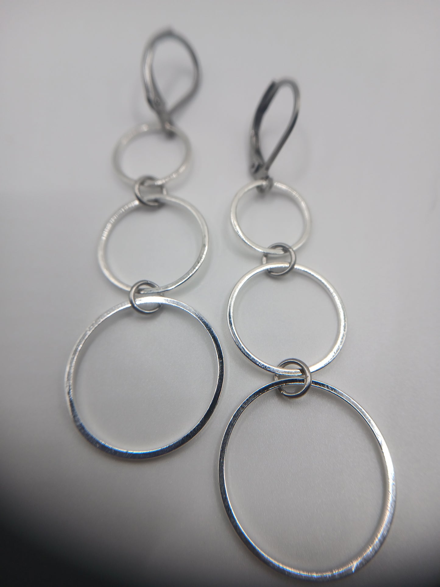 Three silver circles earrings