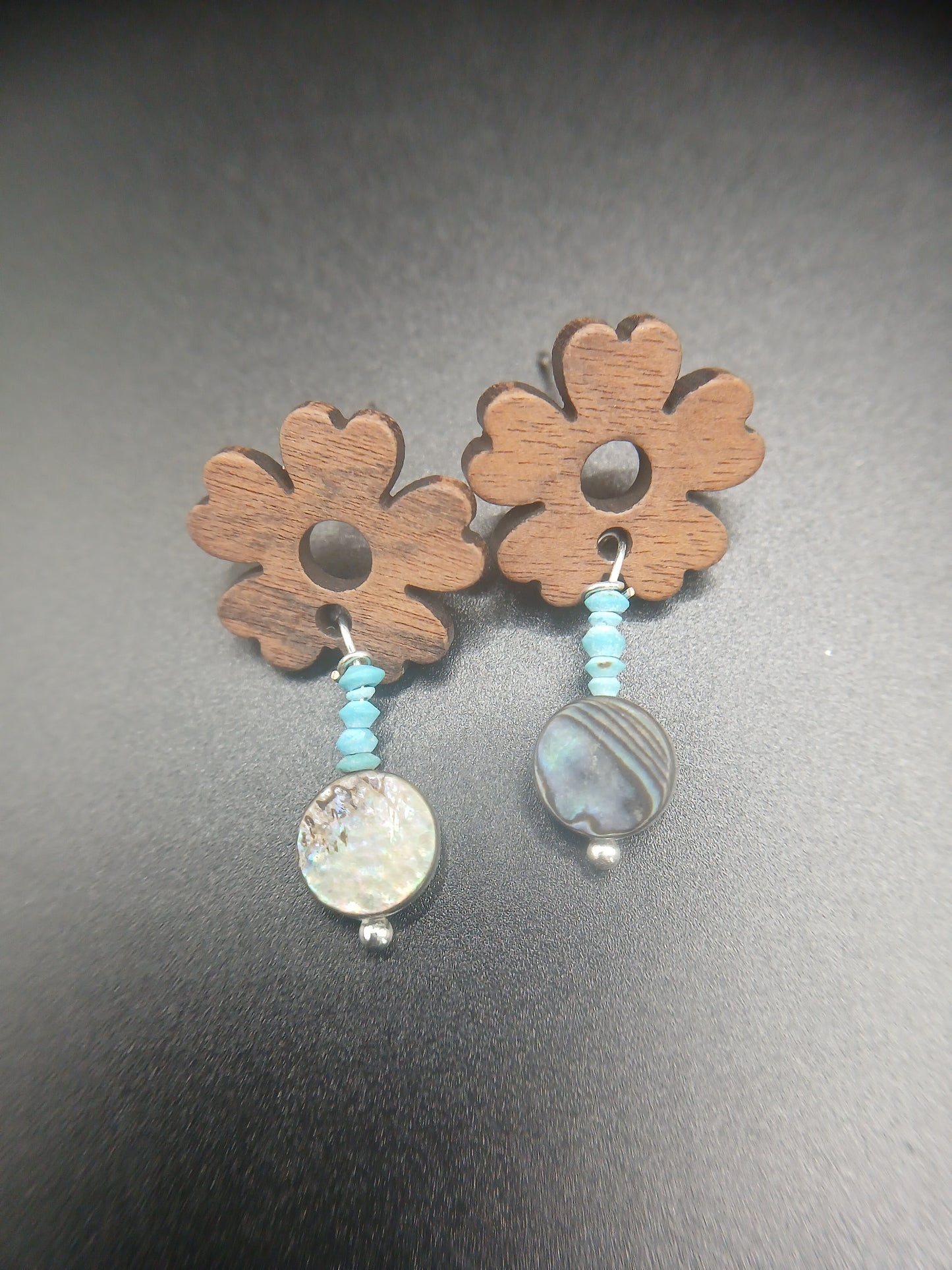 Wooden flowers with abalone posts